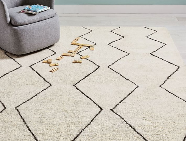 Neutral rug with black zig zag pattern