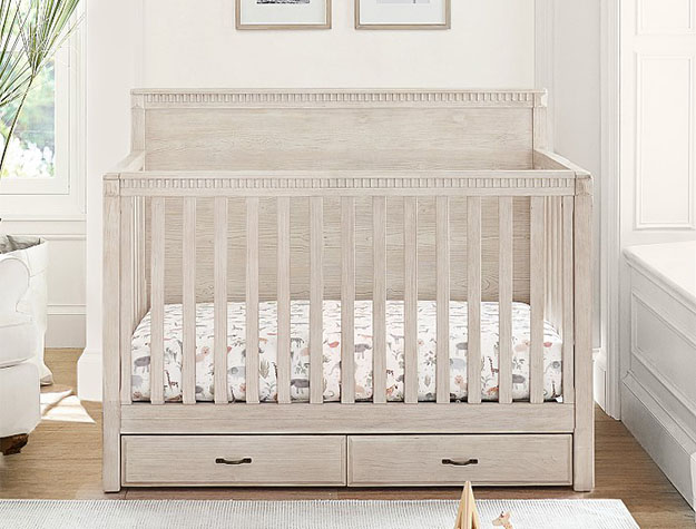 Modern gray crib with built-in wooden storage drawers
