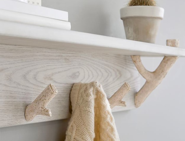 birch wood shelf with organic branch pegs 