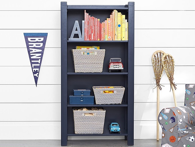 camp kids bookshelf with banner