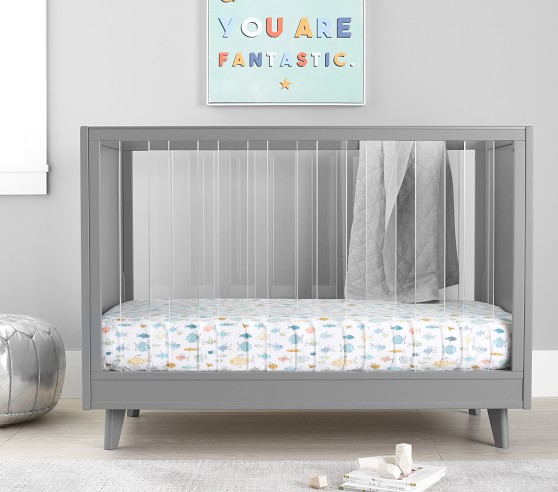 grey cot bed with mattress