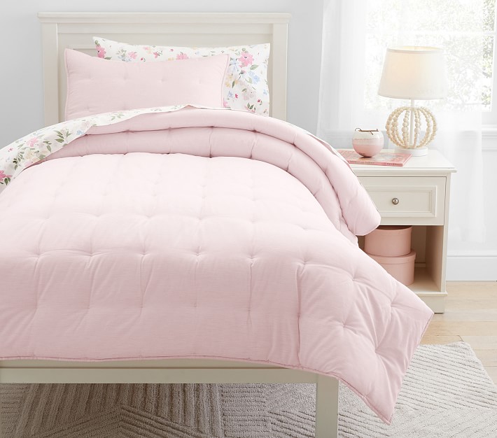 Simple light pink and delicate floral prints bedding.