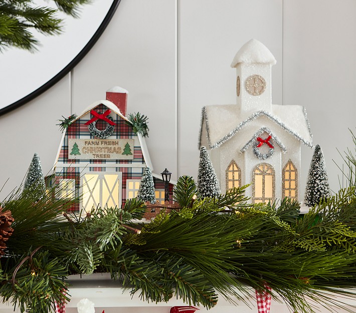 Gallery adds window display with Christmas village, train set