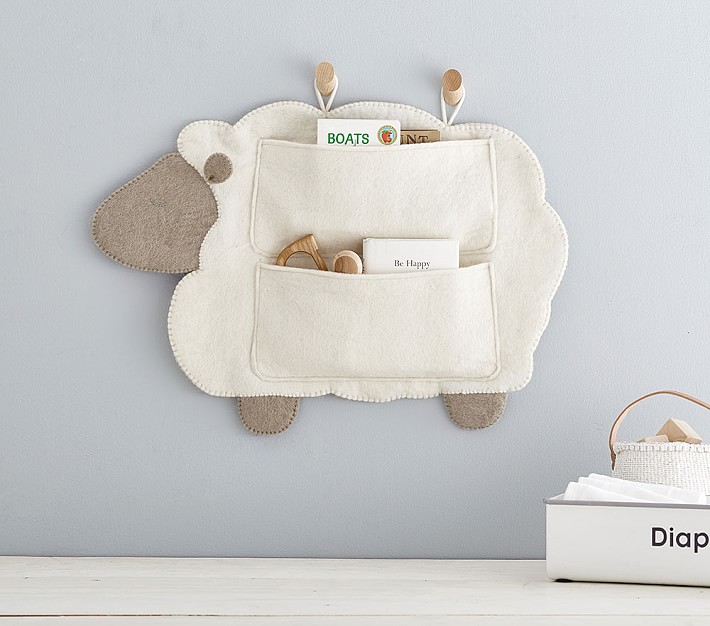 Nursery wall outlet storage