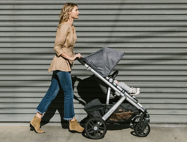mother walking with an UPPAbaby® VISTA Stroller