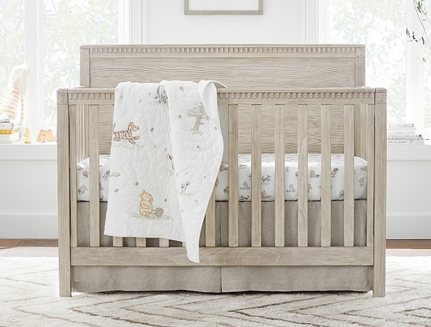 4-in-1 convertible crib with animal blanket