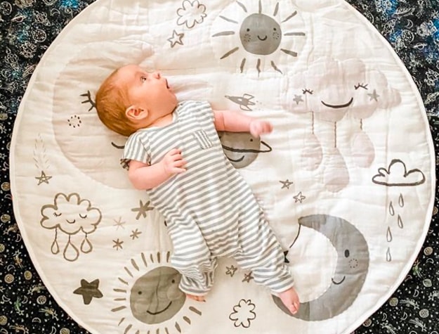 Baby on sun and moon activity mat