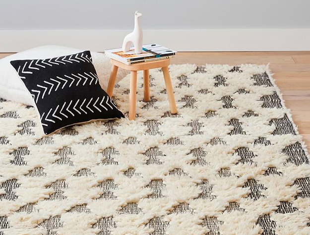 Textured rug with triangles