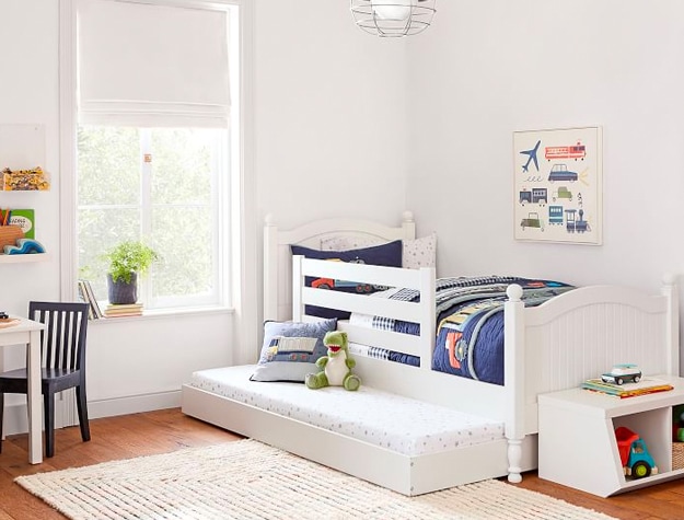 White trundle bed in child’s bedroom