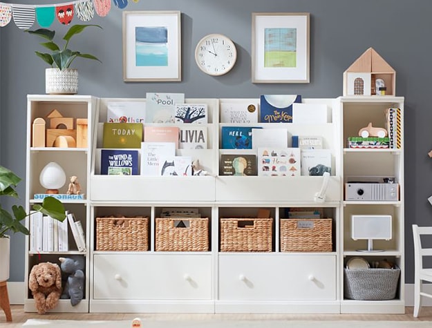Customizable white wall storage system in kid’s playroom