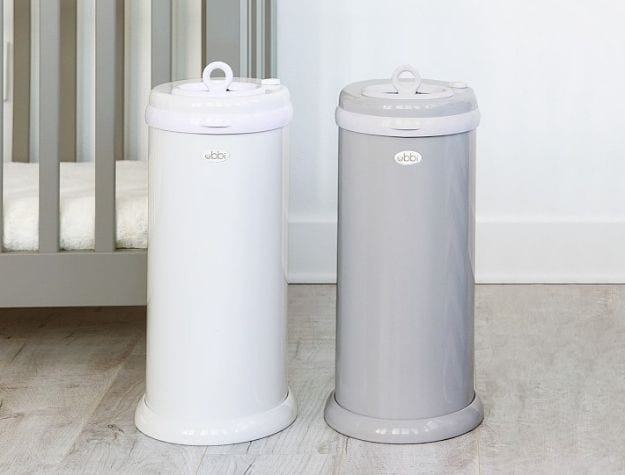 modern diaper pails next to crib