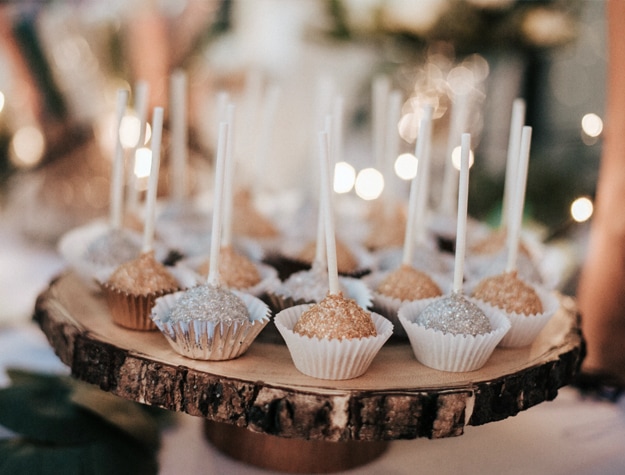 Cake pops on wooden dish