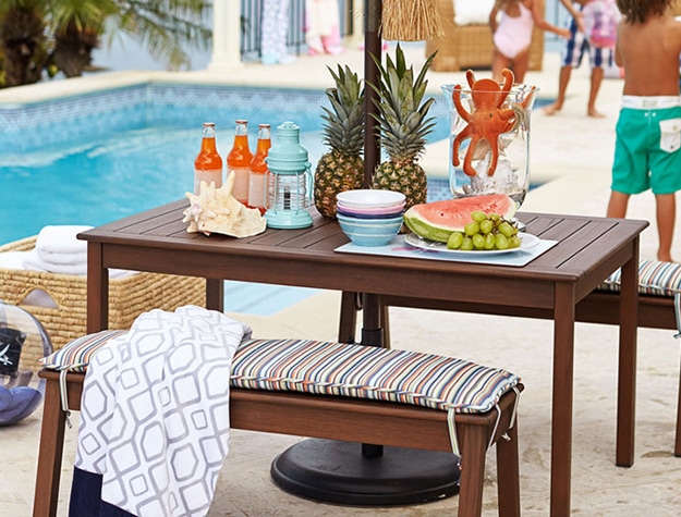 Table with fruit by the pool