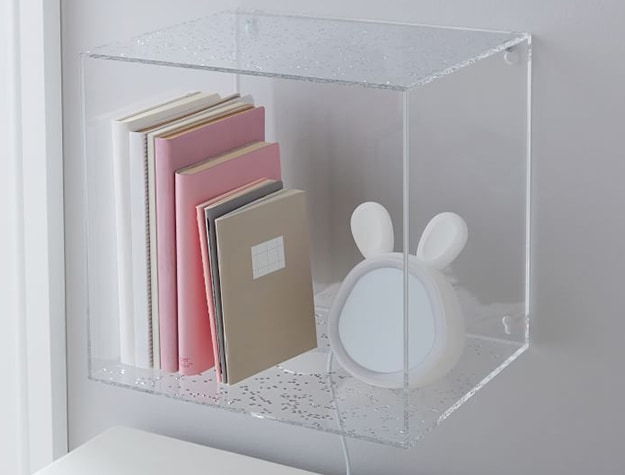 Acrylic utility storage with books and light