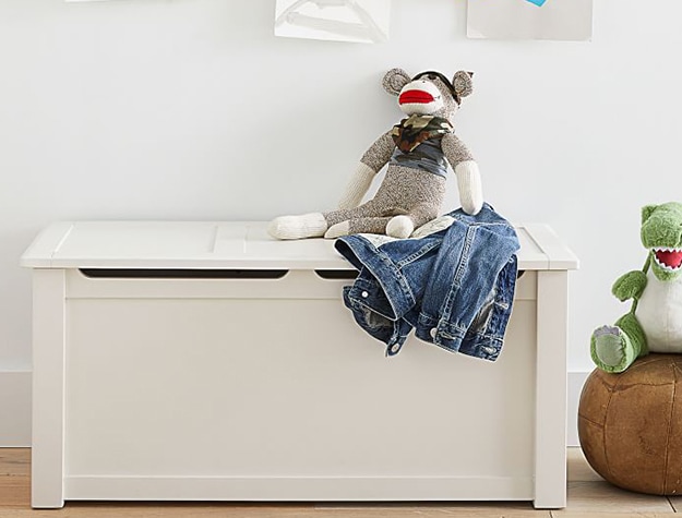 White toy storage with stuffed monkey