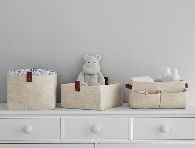 White dresser with tan and leather storage baskets