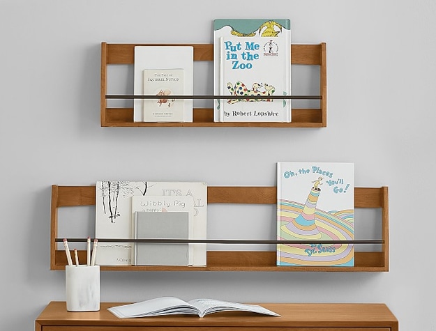 Wall mounted wood storage shelving unit with books and decoration