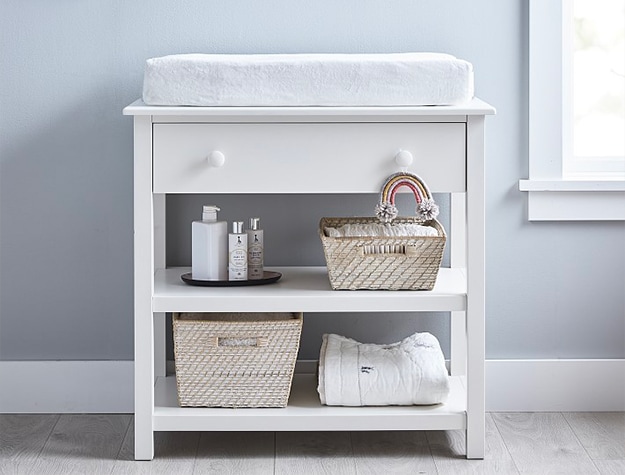 White changing table with open shelf storage