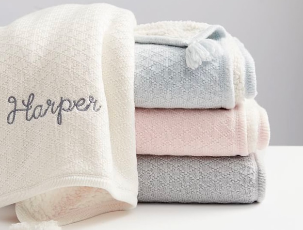 Stack of blankets with monogrammed name Harper