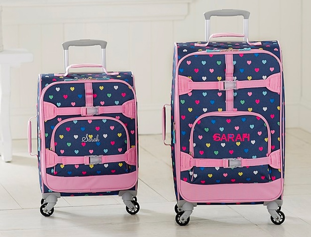 Pair of rolling luggage with girls’ names embroidered on front