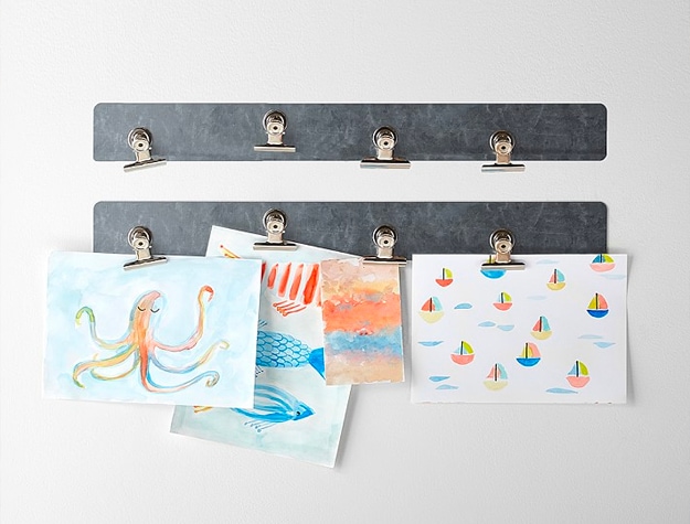 Magnetic wall hanging strips with clips and displaying artwork