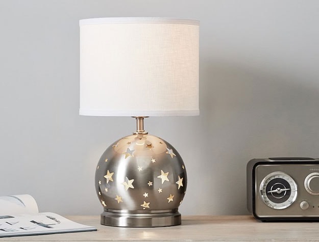 silver lamp with star cutouts