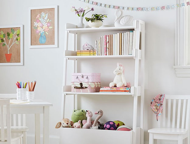 white bookcase with toys and books