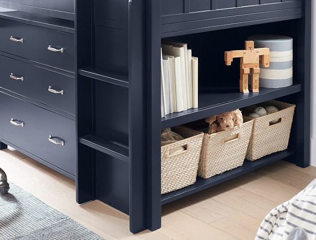 Navy blue loft bed with baskets and bins