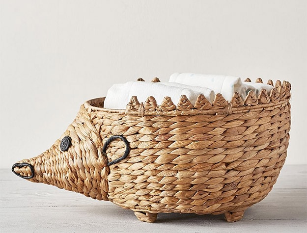 Shaped Hedgehog Diaper Caddy with white towels.