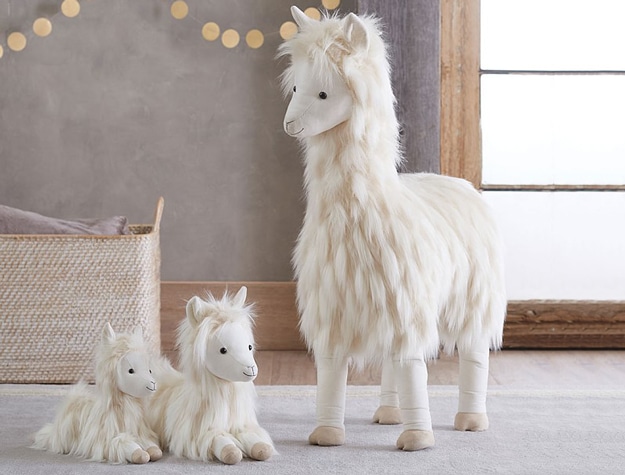 White stuffed llama plush collection.