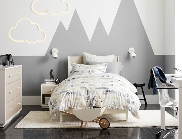 Twin sized Milo Bed with nature inspired artwork on the sheets and pillow.