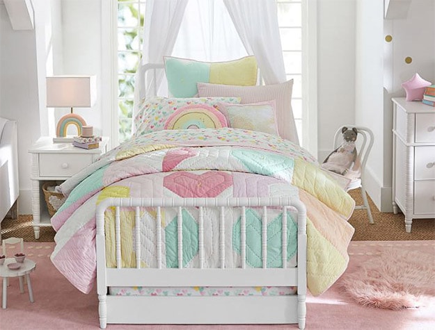 White Elsie Trundle Only bed with colorful sheets and pillows.
