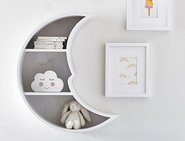 Moon-shaped shelf with toys inside.