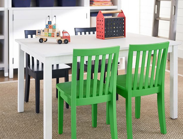 white table with green and blue chairs