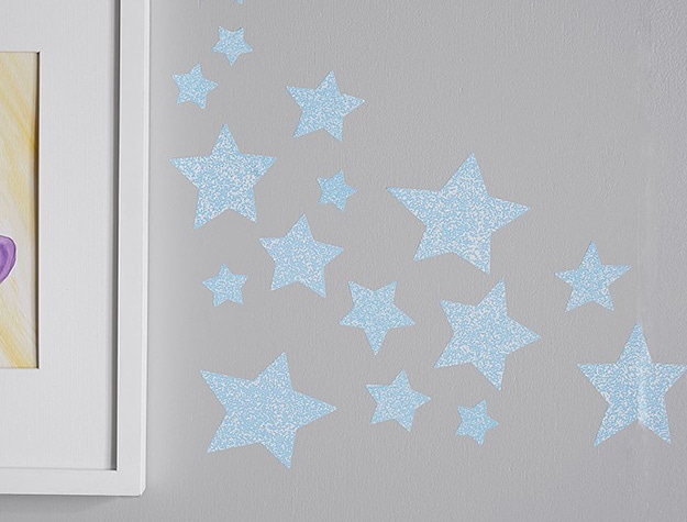 Star Struck glow in the dark decals near framed art.