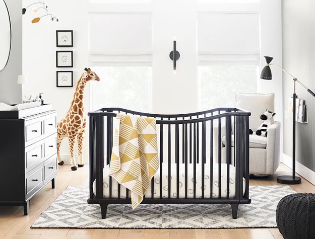 Nursery with a Melissa & Doug Jumbo Giraffe Plush.