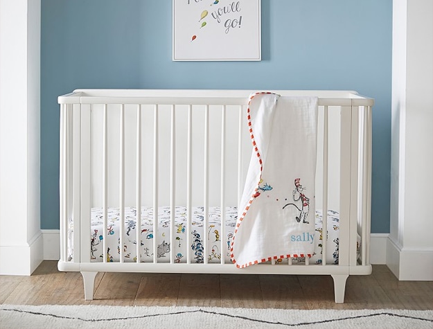 White crib in modern baby nursery