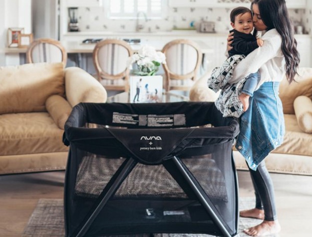 Mom and baby with travel crib
