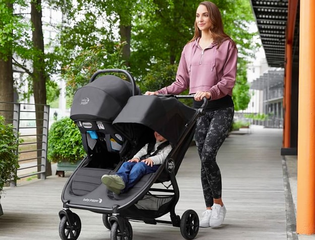 Woman jogging with son in stroller