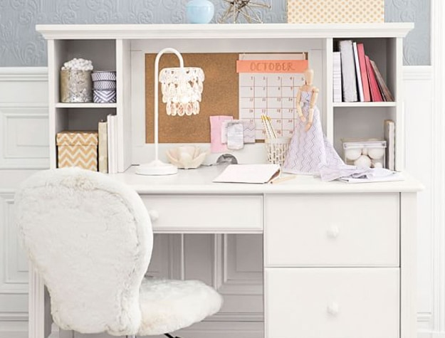 White writing desk with open notebook