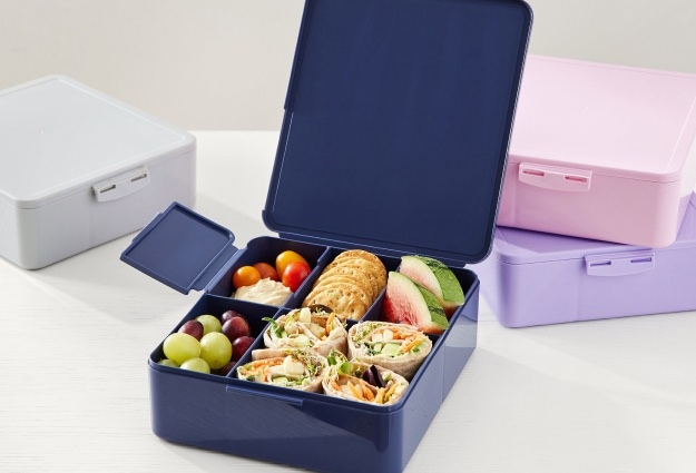 This photo shows the All-in-One Bento Box, which comes in 10 colors, including navy, gray, pink, and lavender.