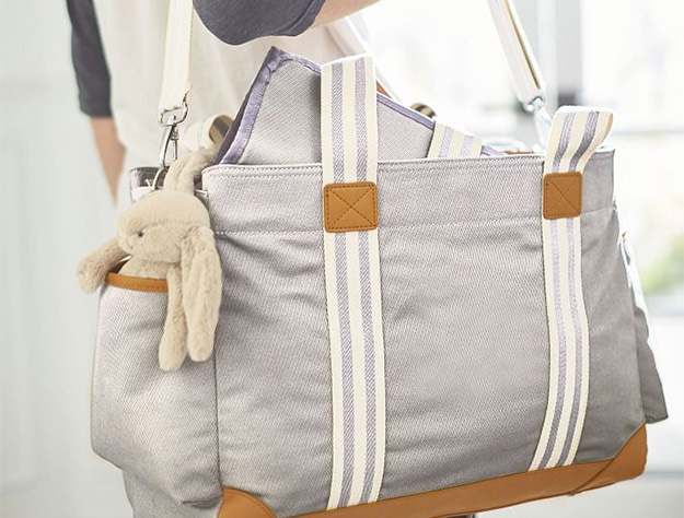 Father holding Classic Diaper Bags.