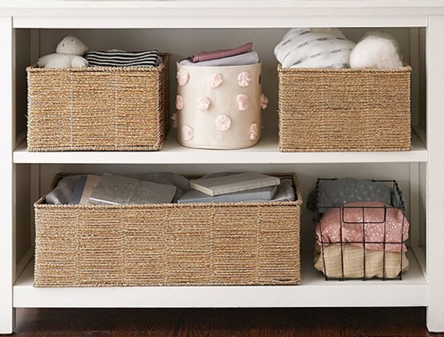 Organized shelving in white bookcase.