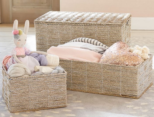 Folded laundry and toys in bins
