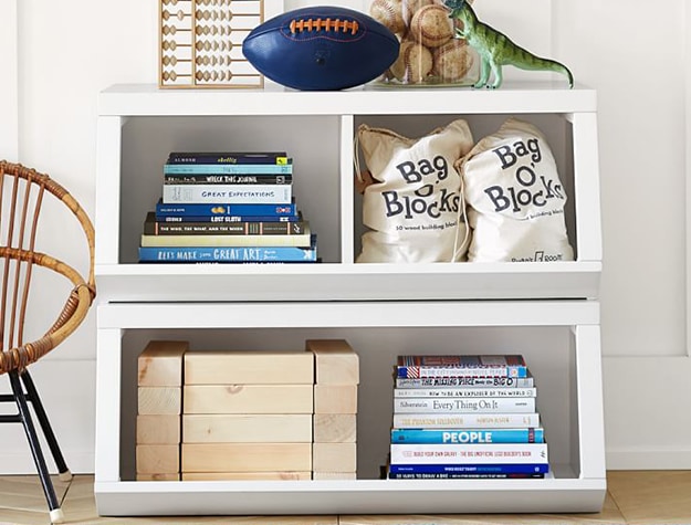 Toys and books in organized bookshelf