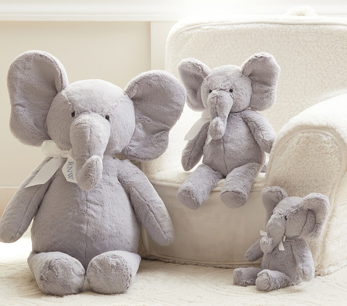 baby with stuffed elephant